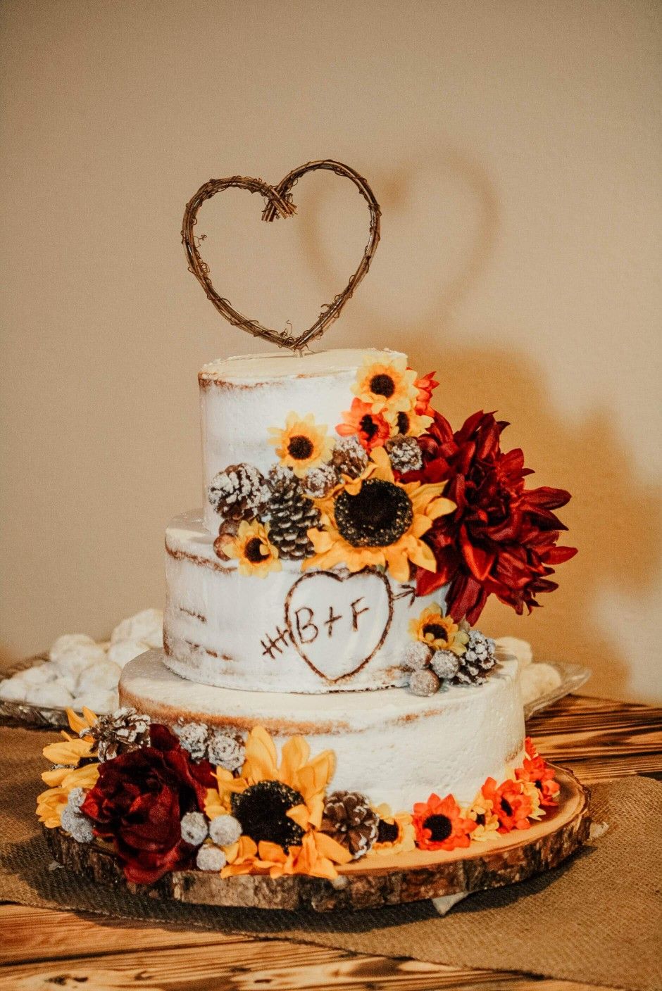 Rustic red and yellow 3 tier birch semi-naked wedding cake with sunflowers