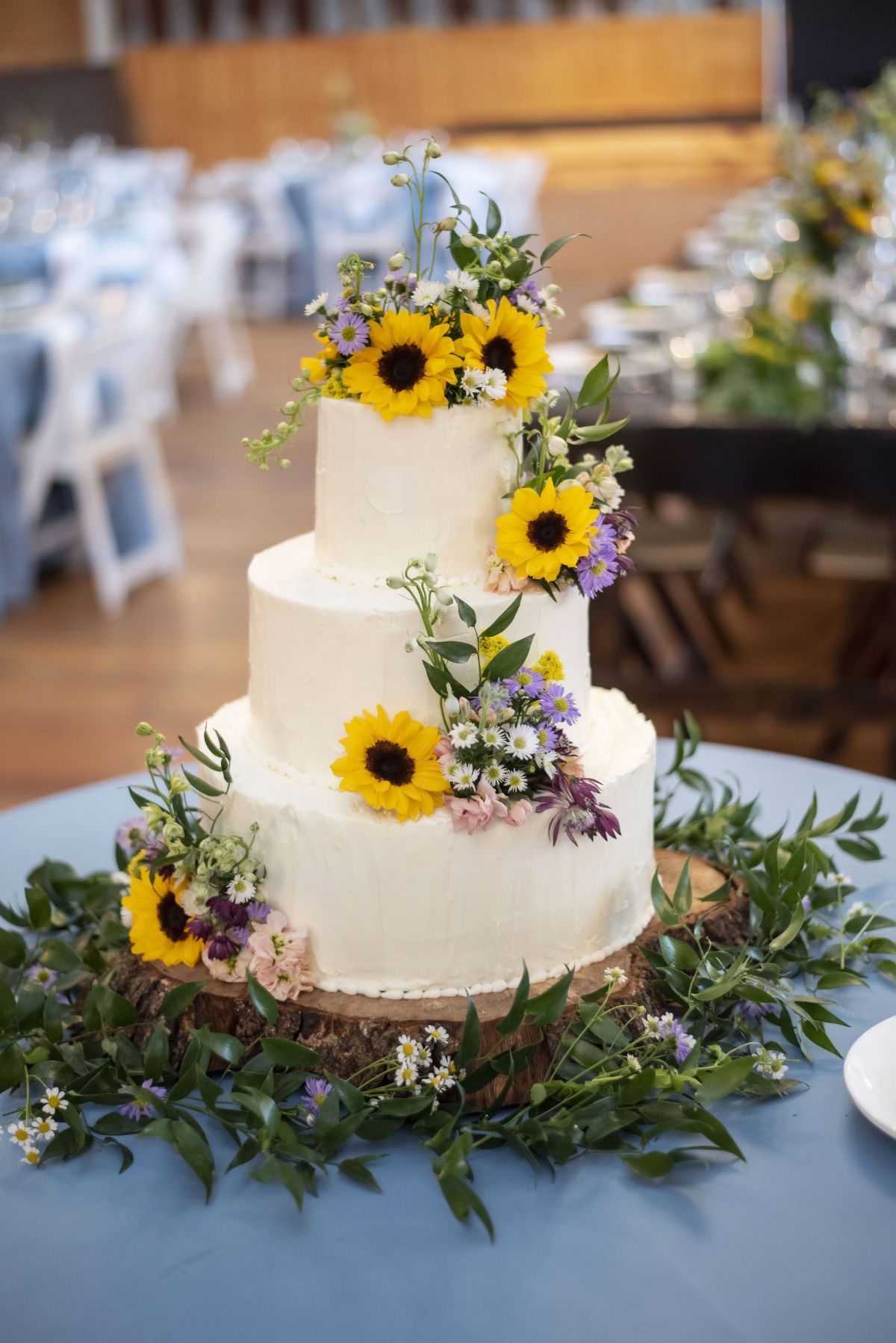 Sunflower Wedding Cake_ Three Tier Cake with Small Wildflowers