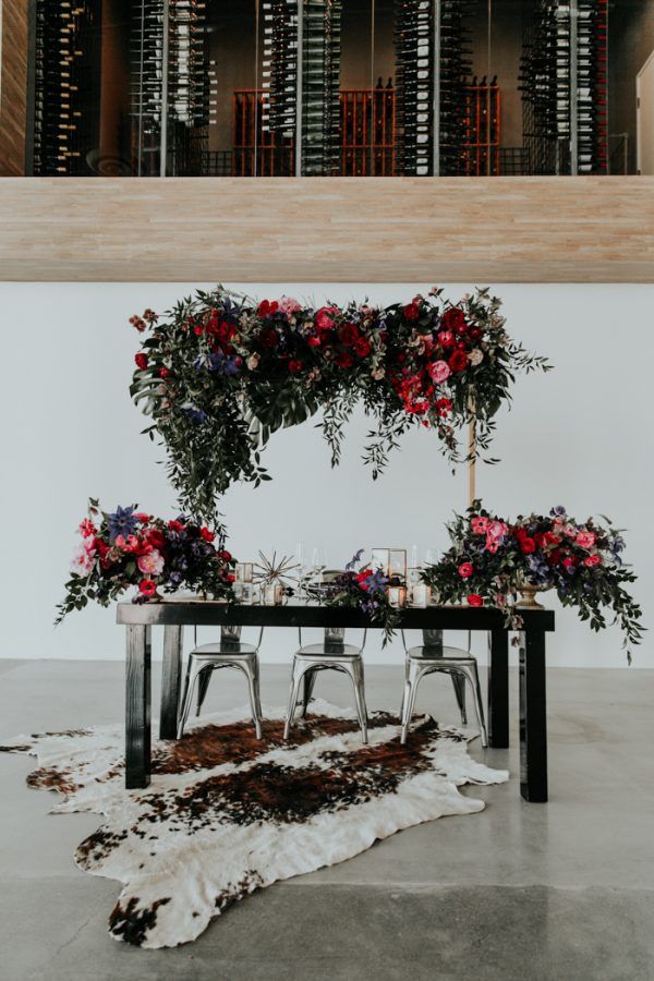 bohemian indoor burgundy black and greenery sweetheart table