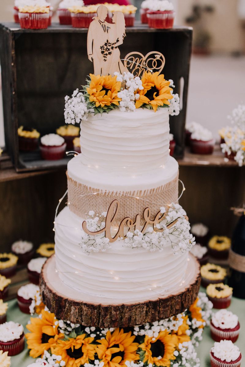 country wedding cake with sunflowers,burlap and wooden laser cut topper