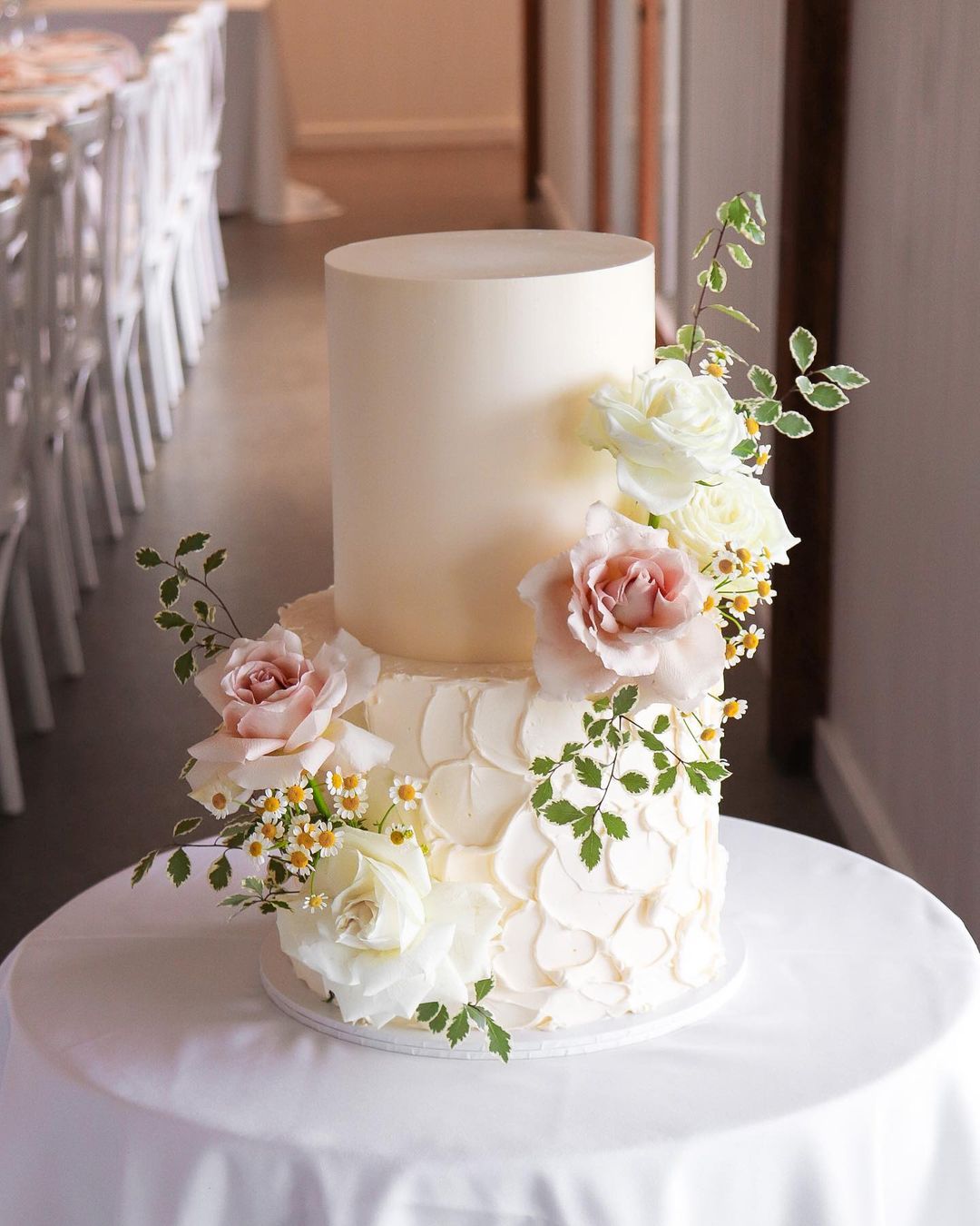 country wedding cake with wildflowers and pink roses via milkandhoney.cakecreative