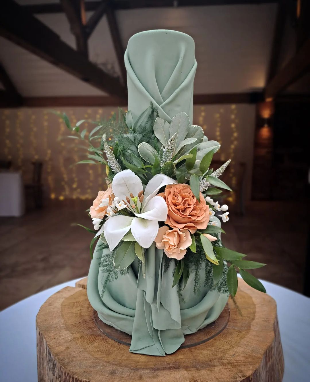 dusty sage elegant wedding cake with orange flowers via perfectcakesco