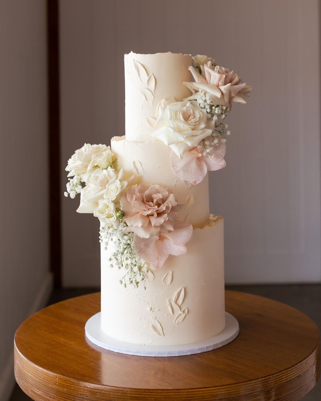 elegant 3 tier wedding cake with blush roses via milkandhoney.cakecreative