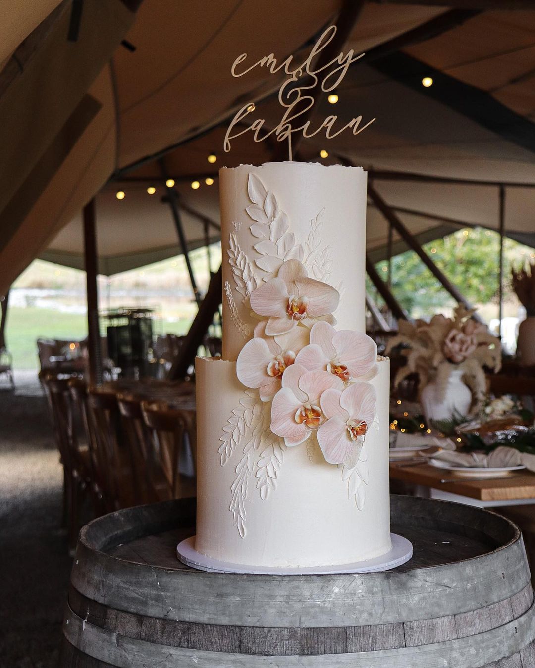 elegant white wedding cake with blush orchids via milkandhoney.cakecreative