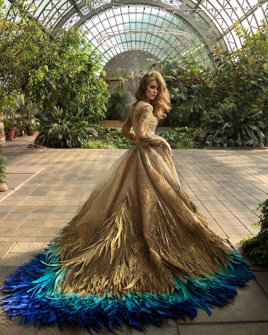 gold and blue princess feathers wedding dress