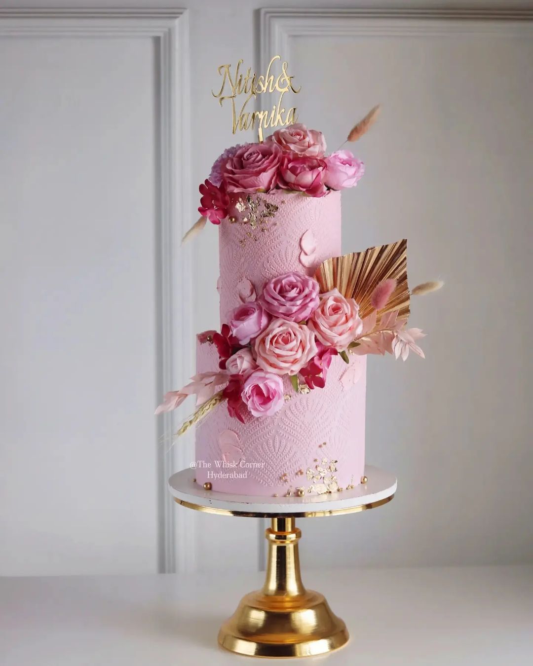 hot pink boho wedding cake with gold leaves via thewhiskcorner