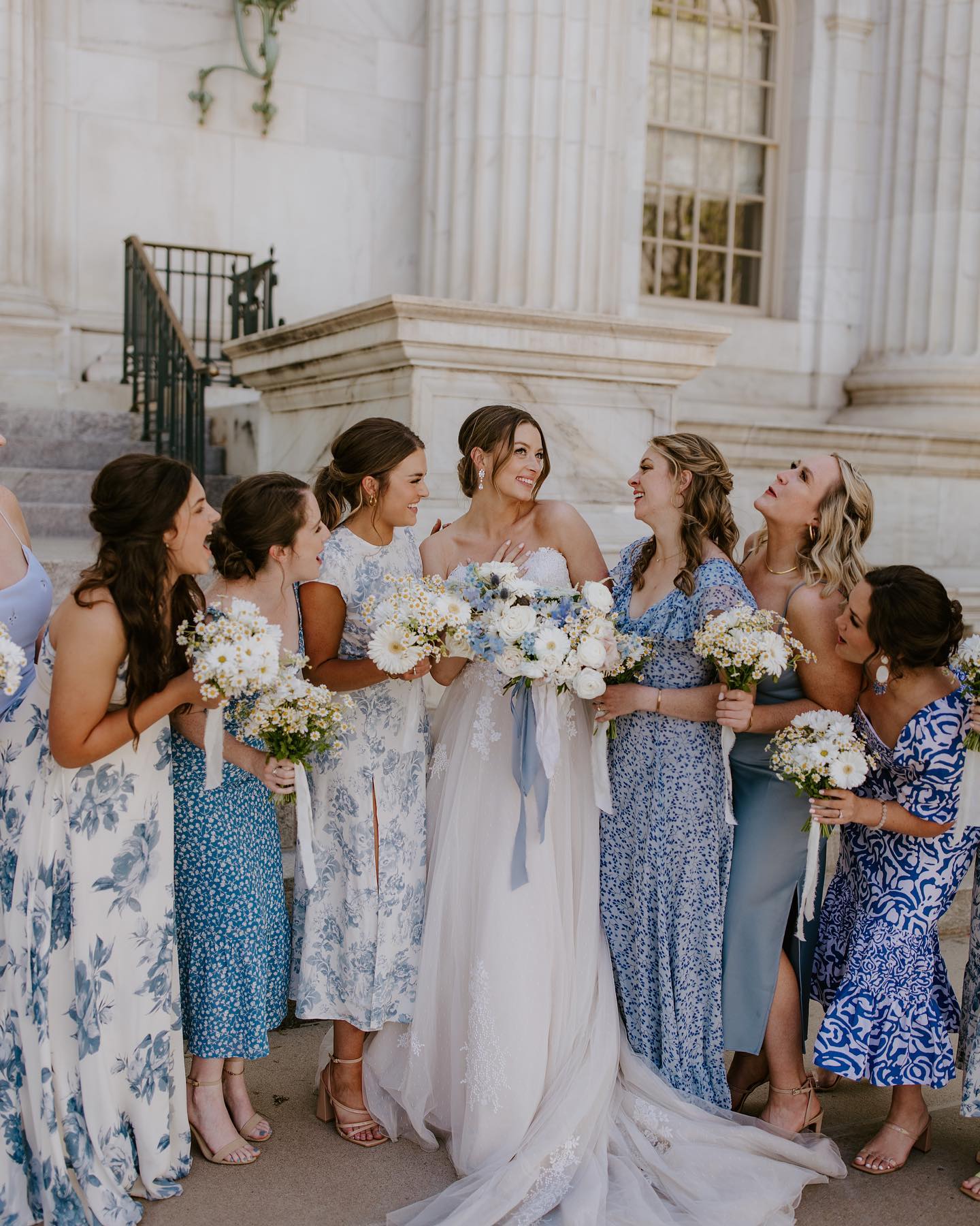 mix and matched midi light blue bridesmaid dresses