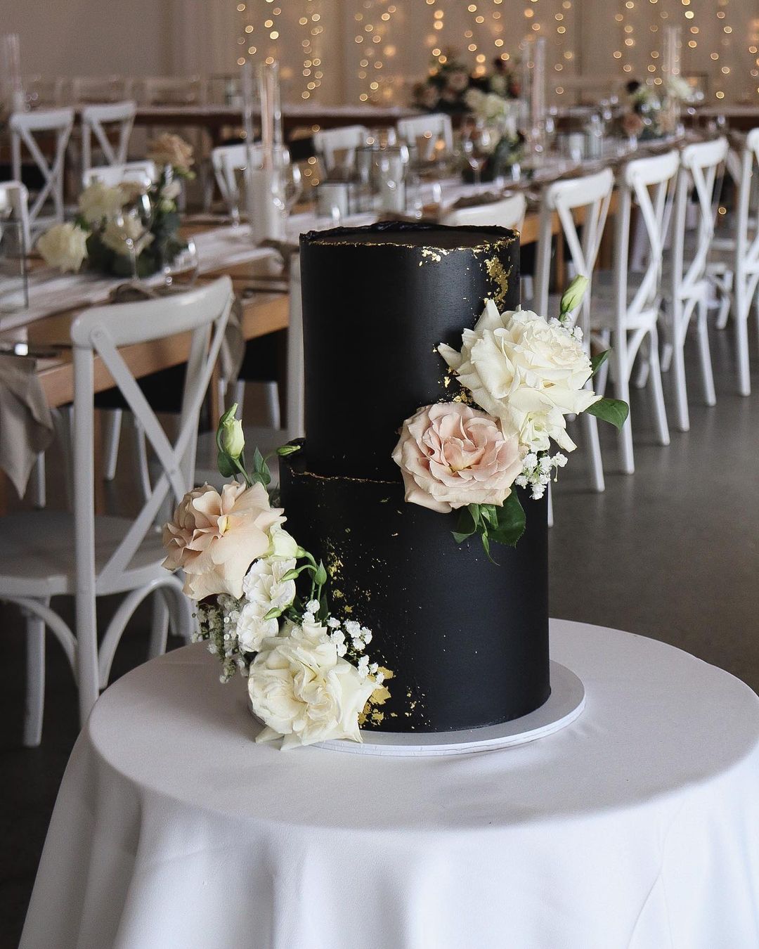 modern black wedding cake with blush roses via milkandhoney.cakecreative