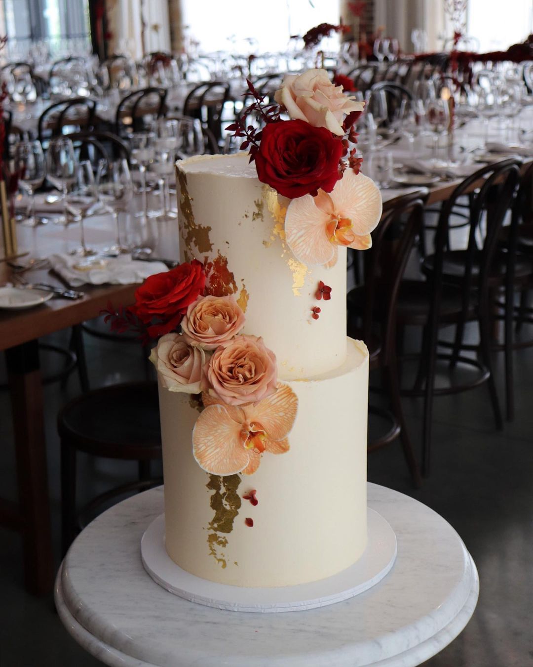 modern elegant wedding cake with beige orchids and roses via milkandhoney.cakecreative