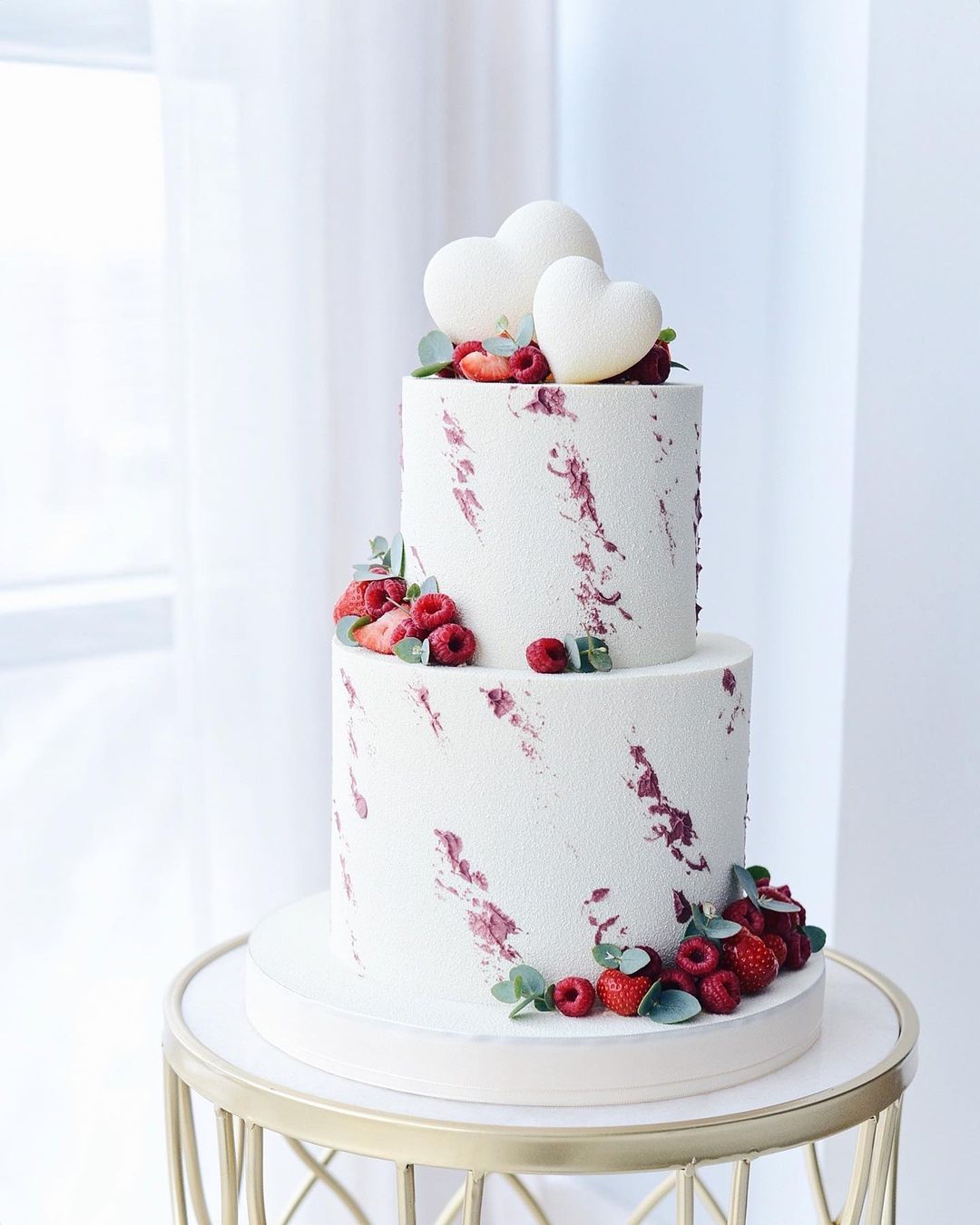 modern white matte forested wedding cke with red raspberry via boni_bakery