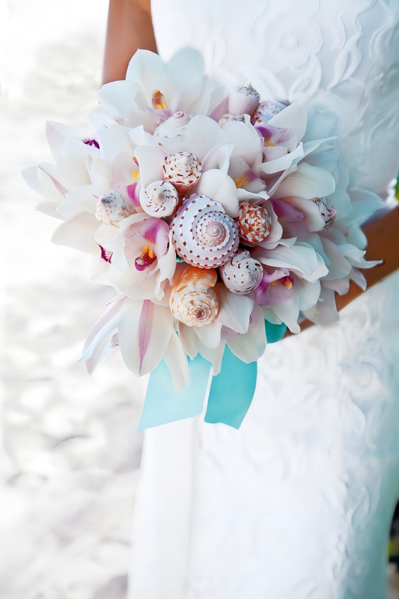 pink beach wedding bouquet with conchs