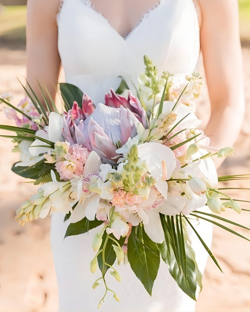pink protea tropical bridal bouquet via simplemauiwed
