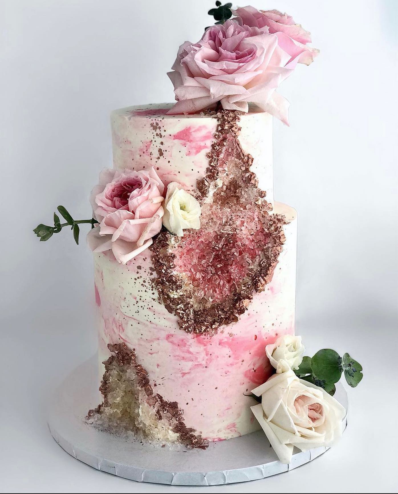 pink watercolor geode wedding cake with sugar crystal stone