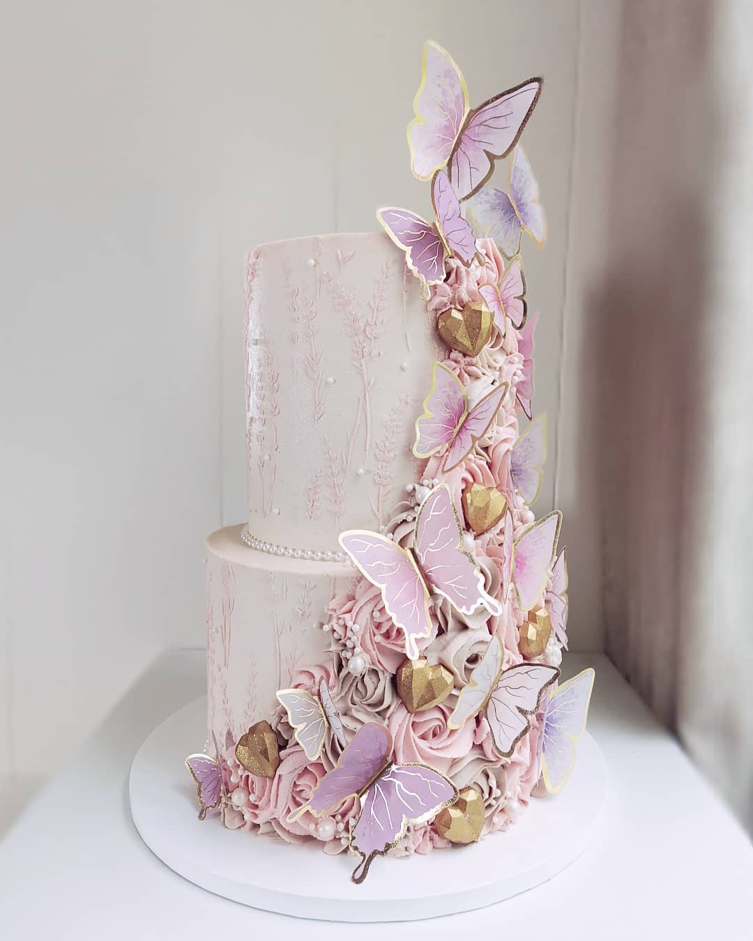 romantic pink butterfly wedding cake via littlemissfattycakes