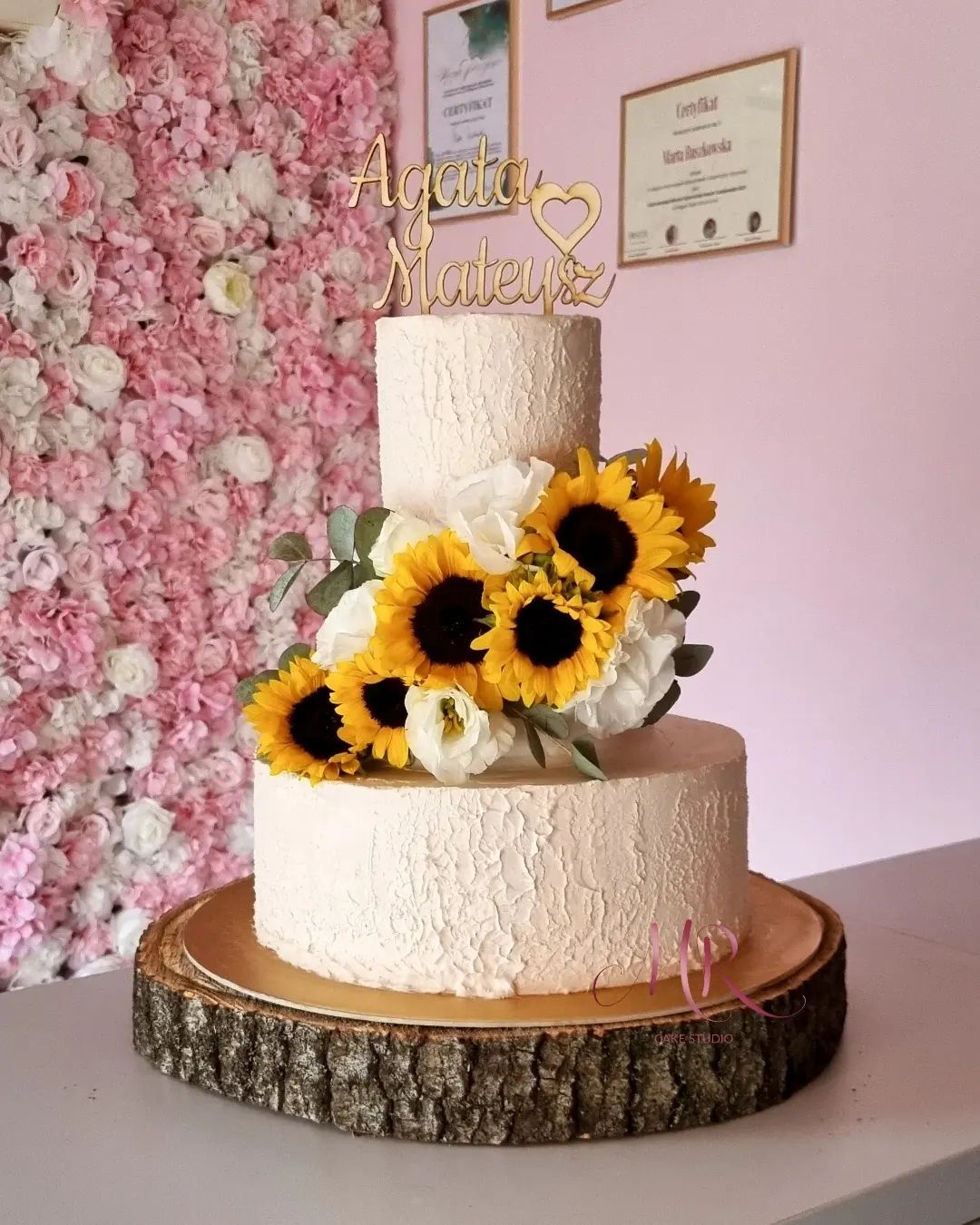 rustic sunflower wedding cake with wooden couple name topper mr_cakestudio
