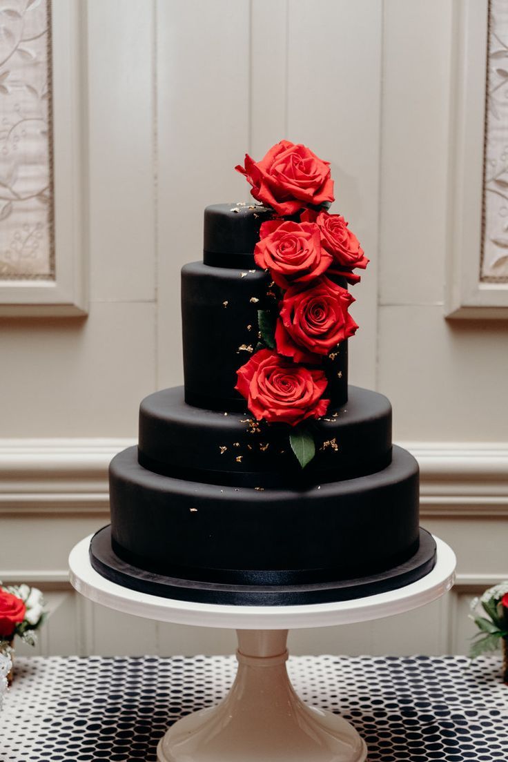 simple 4 tier black wedding cake with red roses