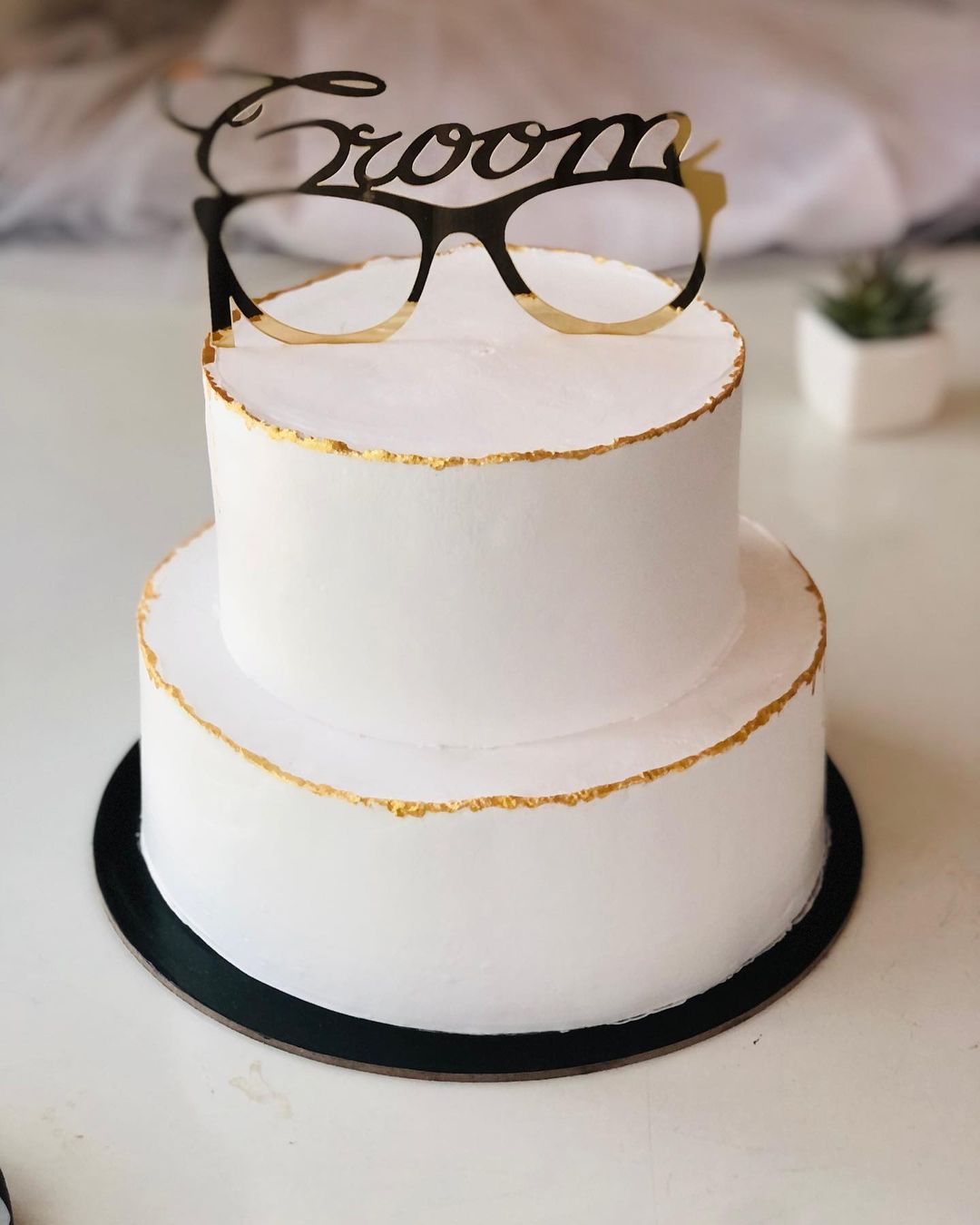 simple two tier groom cake with glasses toper via shaaz__kitchen