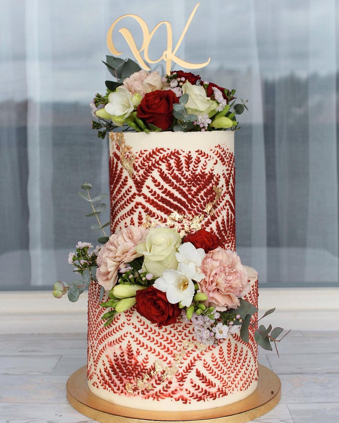 two tier red wedding cake via sraa_bakery
