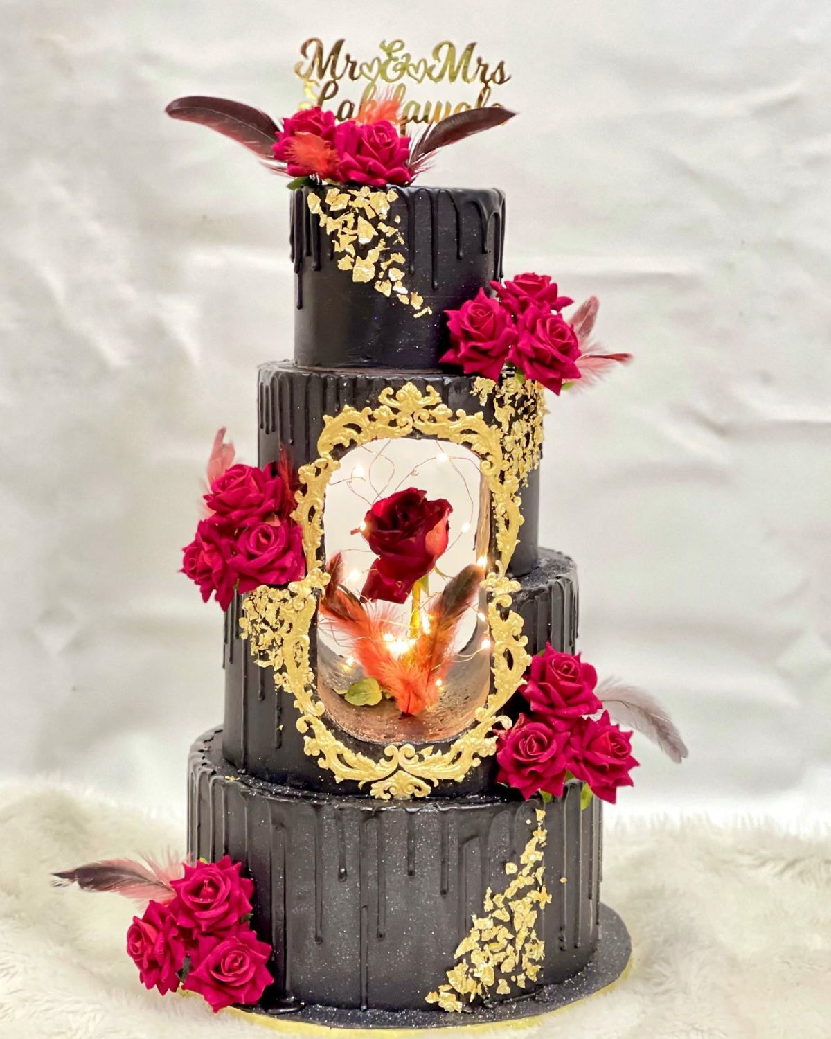 vintage 4 tier black red and gold beauty and the beast wedding cake