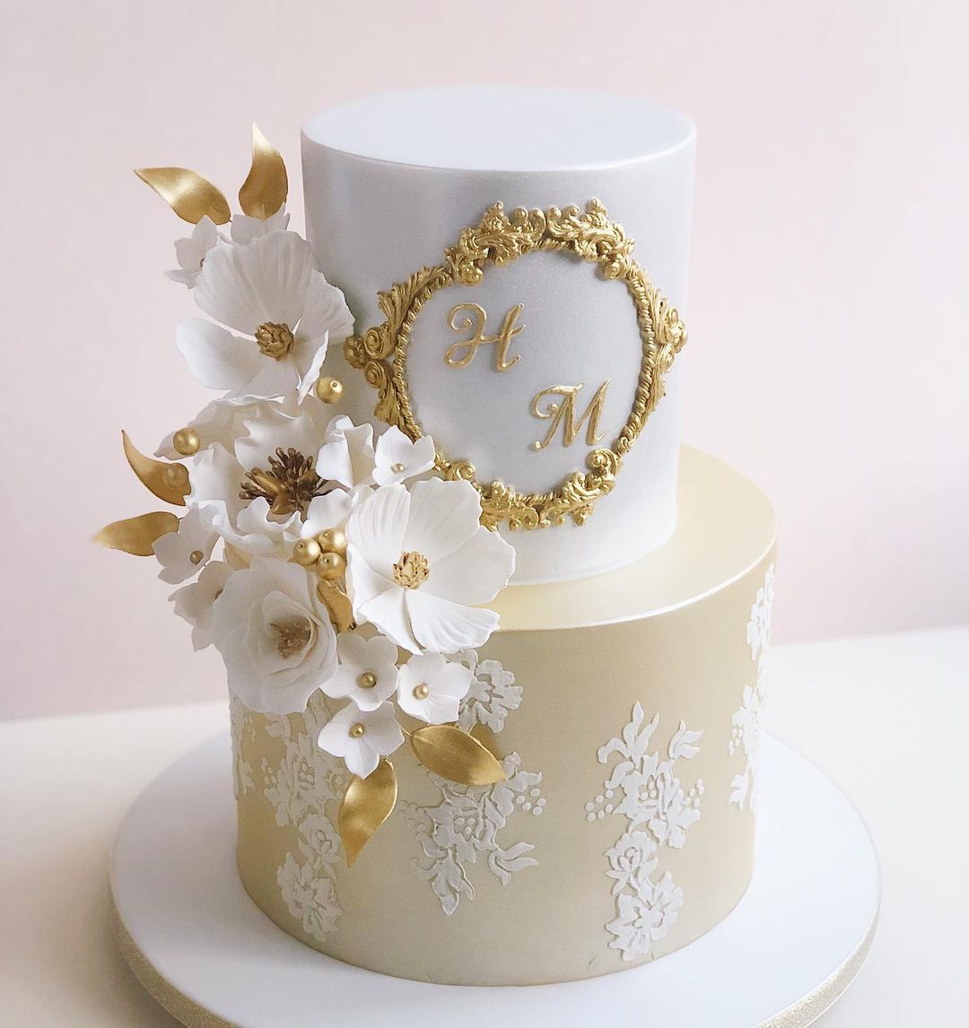 vintage gold and white wedding cake with sugar flowers via panachecakedesign