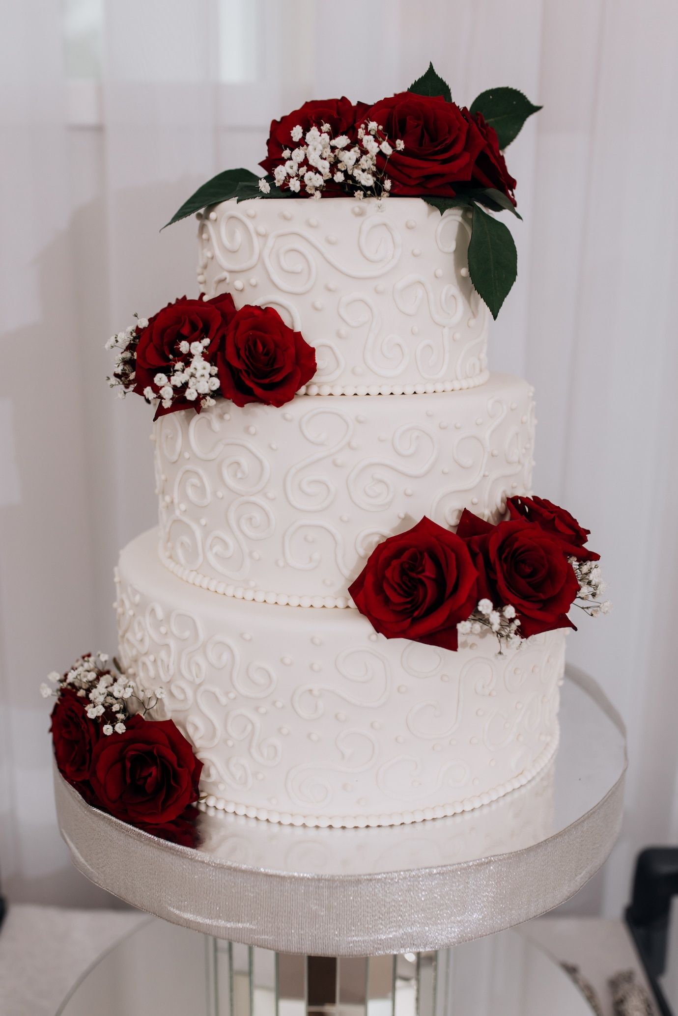 vintage red wedding cake decorated with red roses