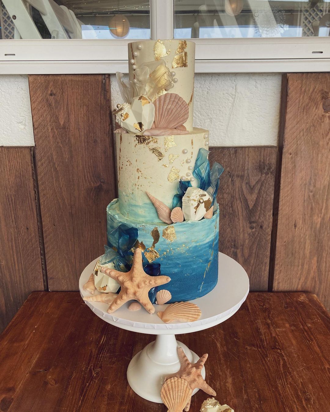 3 tier starfish and shell wedding cake for beach whitepeonycakeco
