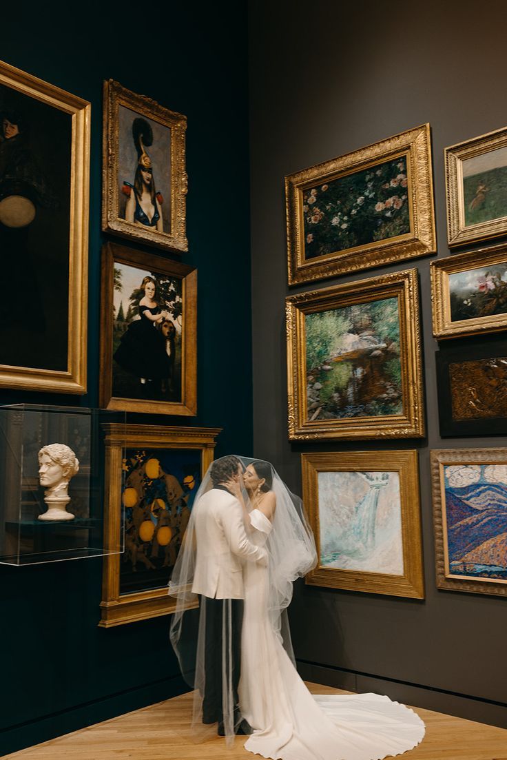Bridal Portraits in an Art Gallery Crystal Bridges Art Museum with long veil
