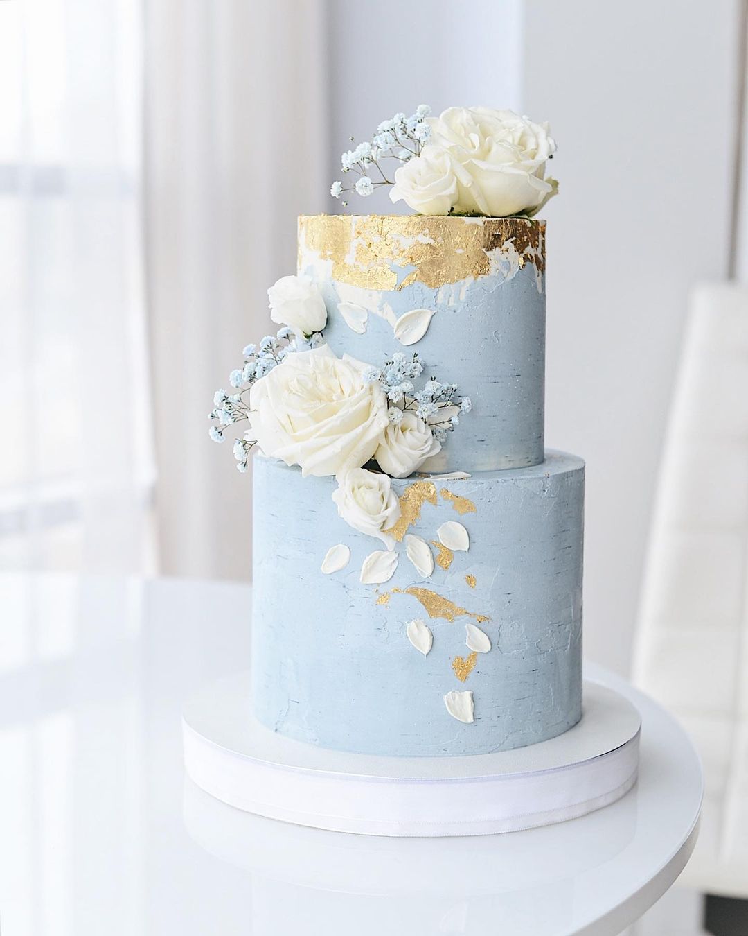 light blue wedding cake with gold foil