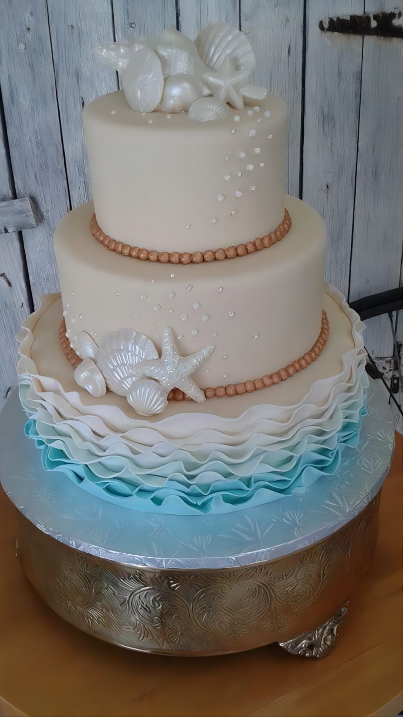 elegant blue ombre ruffled beach wedding cake