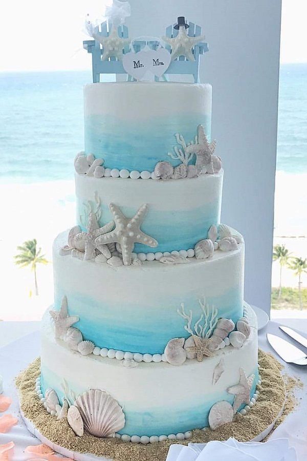 light blue 4 tier summer beach wedding cake with starfish shell