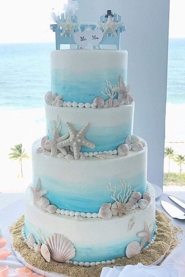 light blue 4 tier summer beach wedding cake with starfish shell