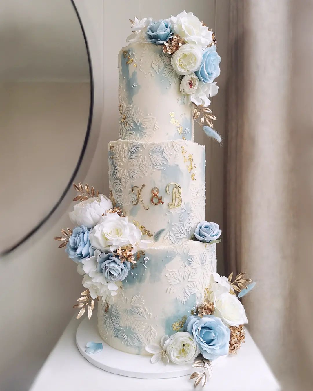 luxury light blue and gold wedding cake with mirror decorating via littlemissfattycakes