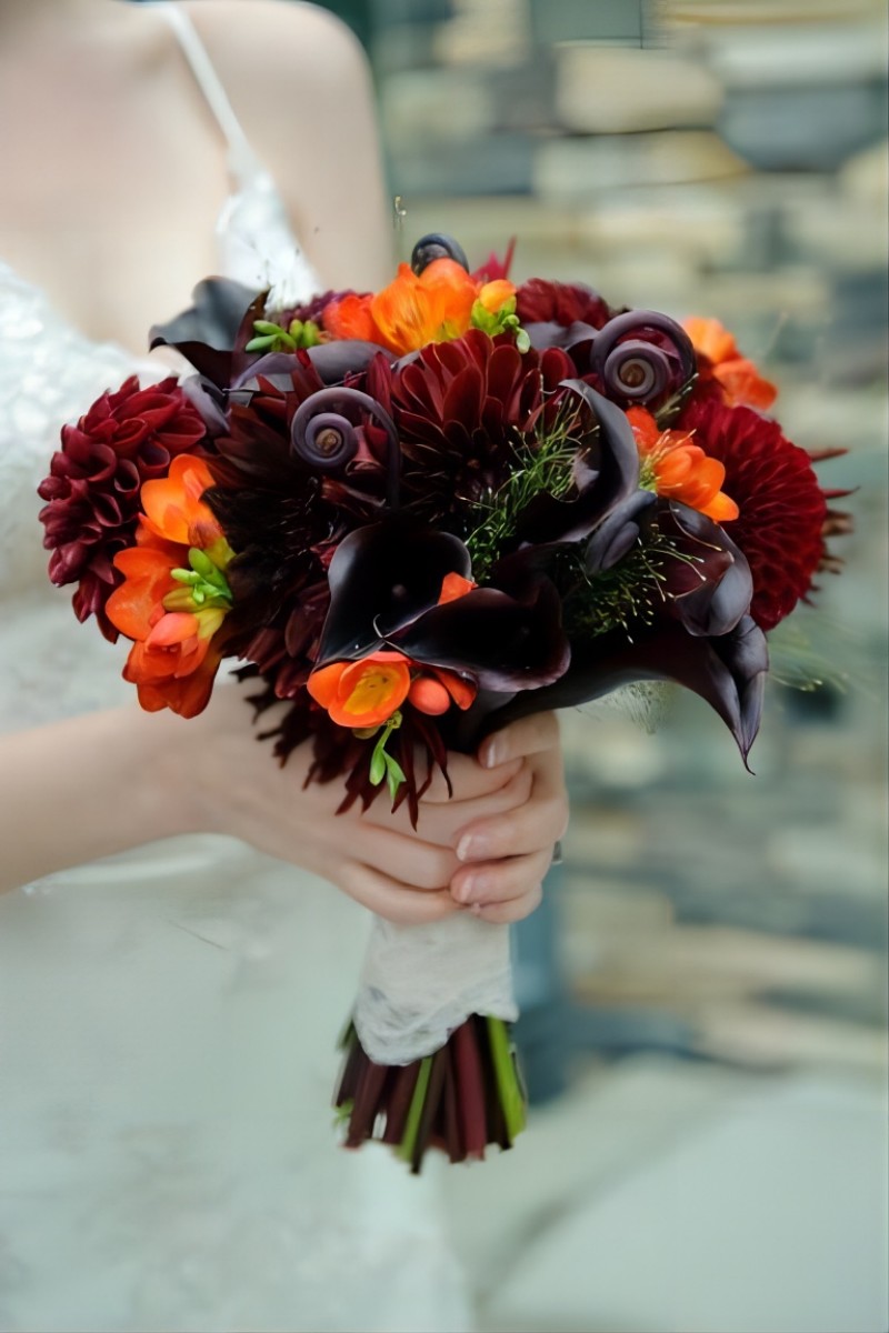 orange freesia purple black wedding bouquet