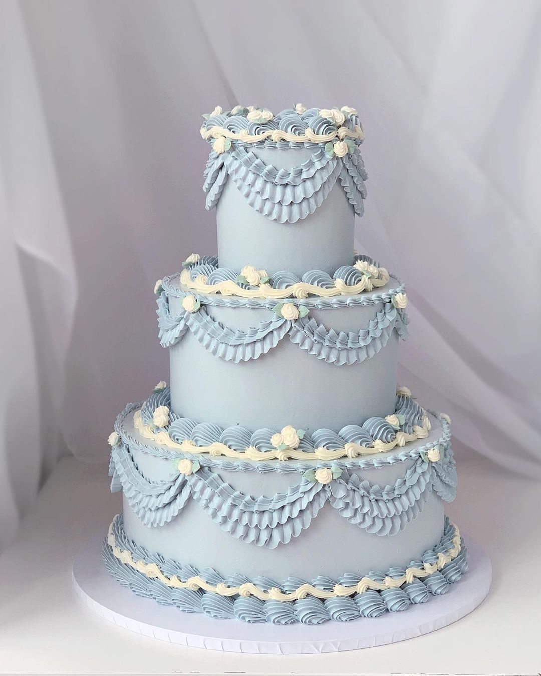 vintage princess dusty blue wedding cake via aprilsbakerlondon