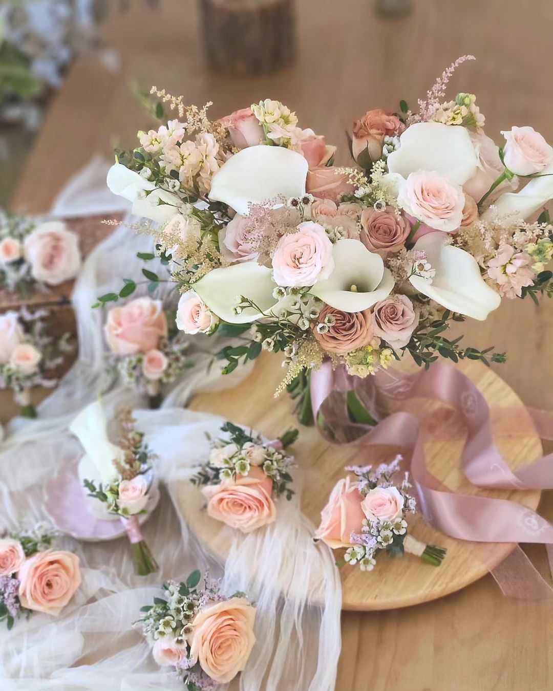 white calla lily and dusty rose wedding bouquet via jpfloral