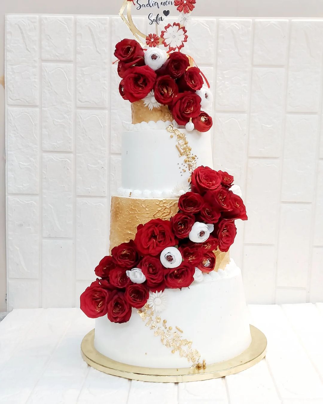 4 tier white old and red sugar flowers wedding cake via sweetbite