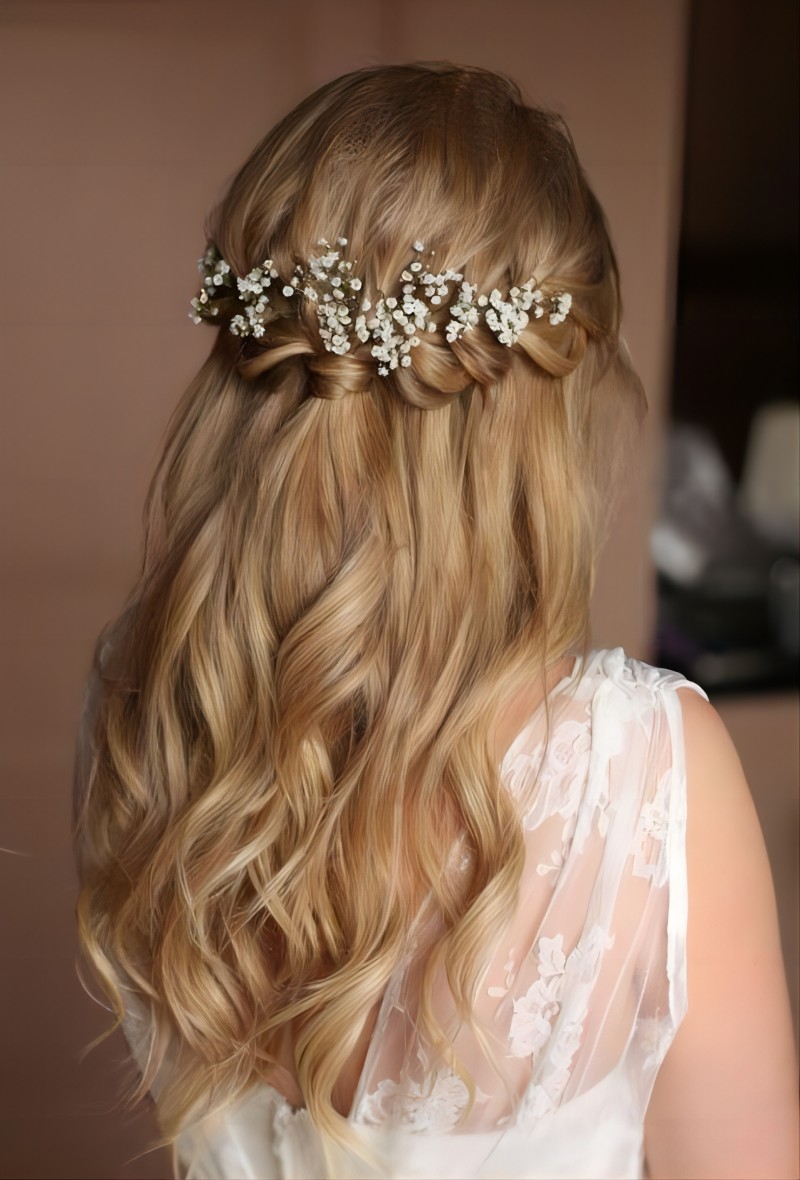 Half up half down homecoming hairstyle with flowers