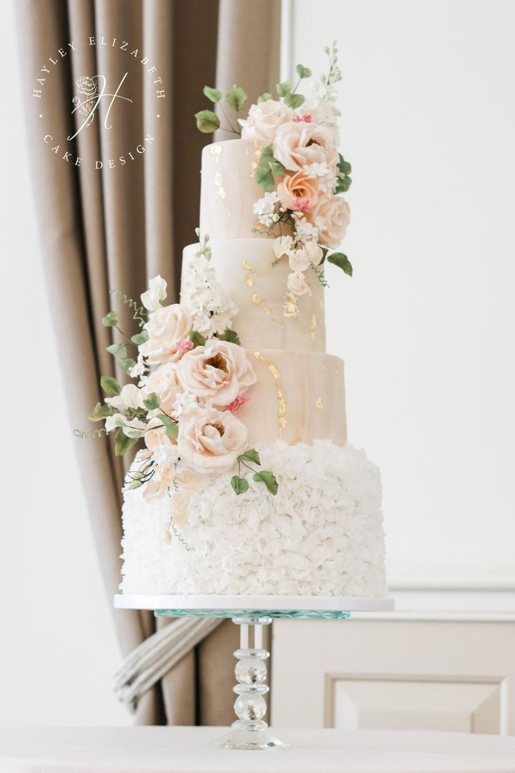 Pink sugar flowers and ruffle wedding cake