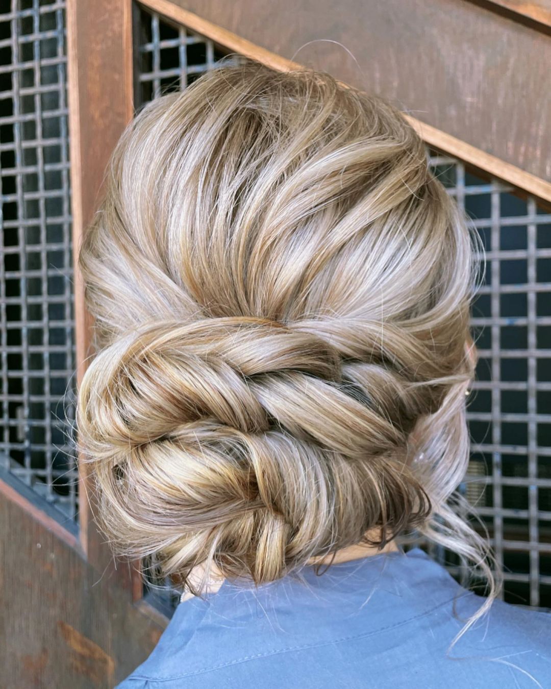 bloned chic twist low bun bridesmaid updo