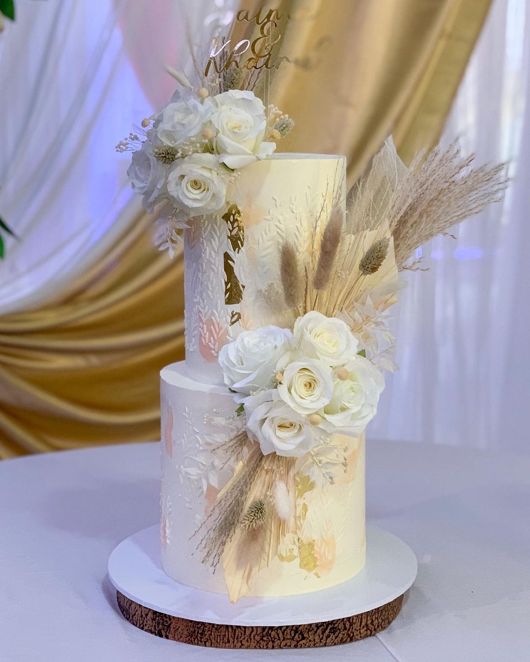 boho fall wedding cake with white pink artificial flowers via amelias__cakes