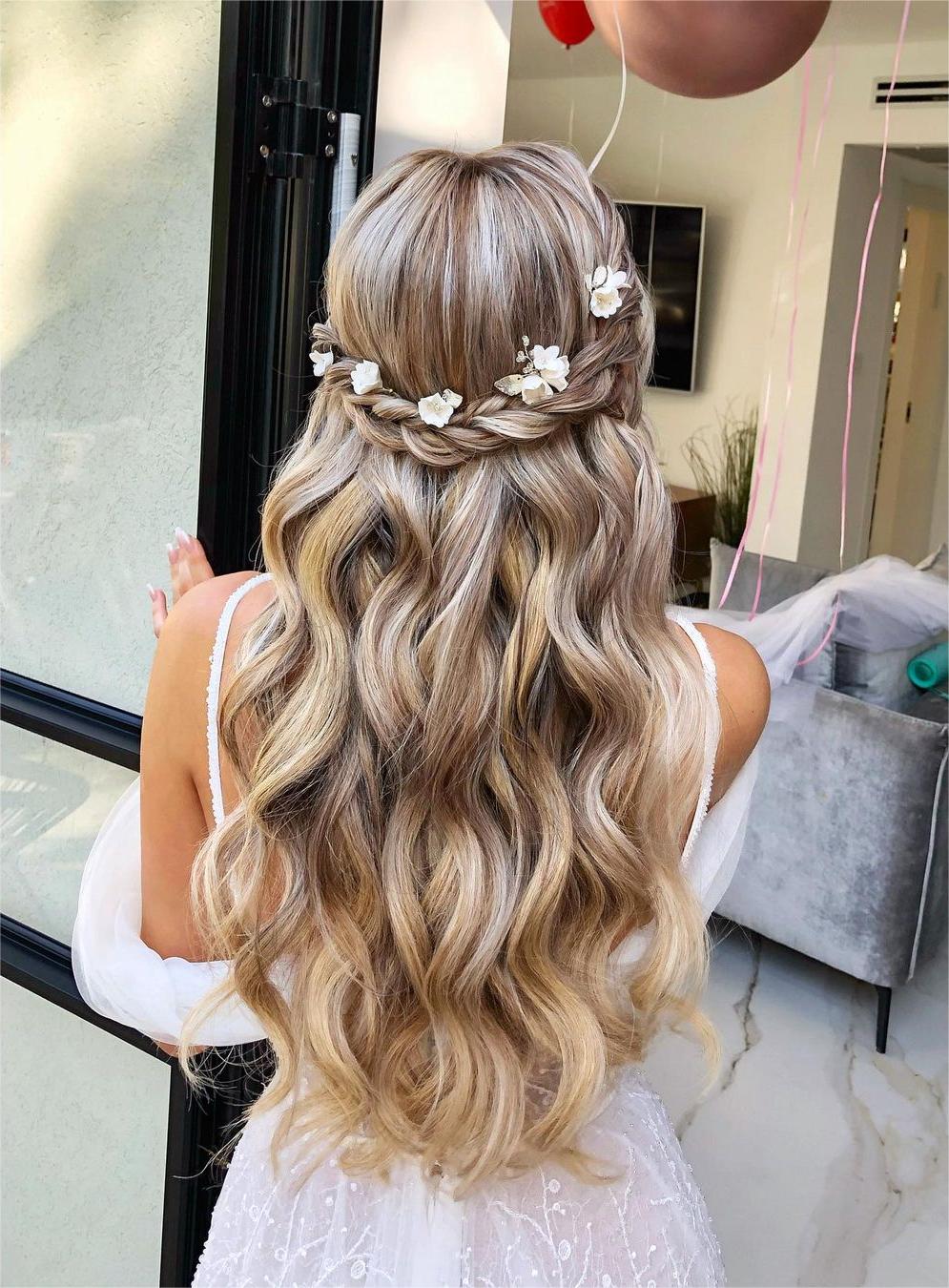 boho flower corwn braided half up half down homecoming hair via zhanna_syniavska