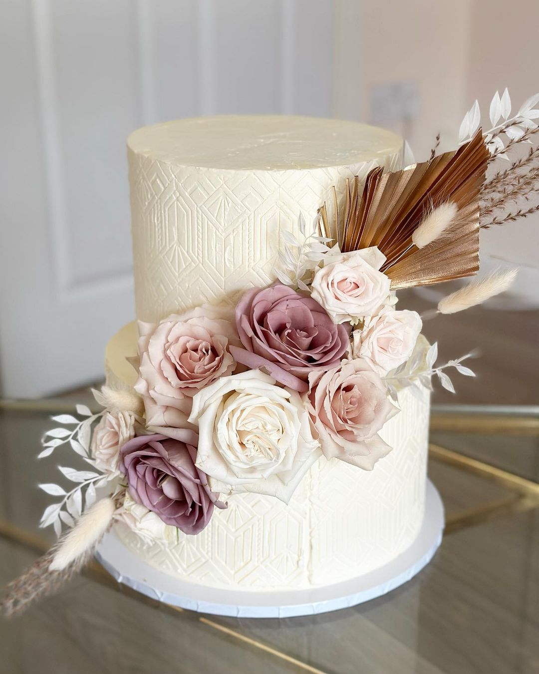 bohoemian two tier texture wedding cake with mauve roses via amelias__cakes