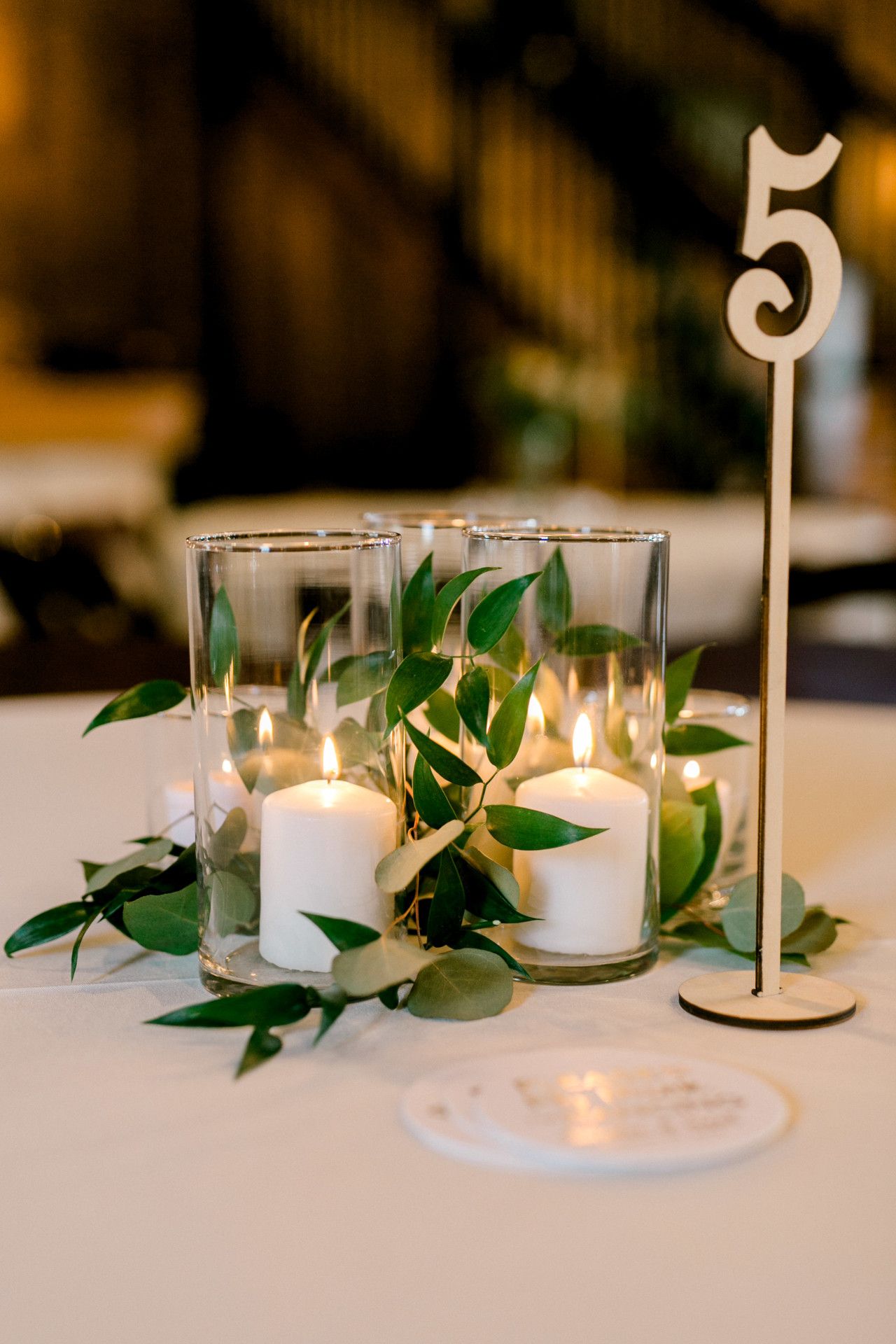 candle wedding centerpiece with tall wooden table number