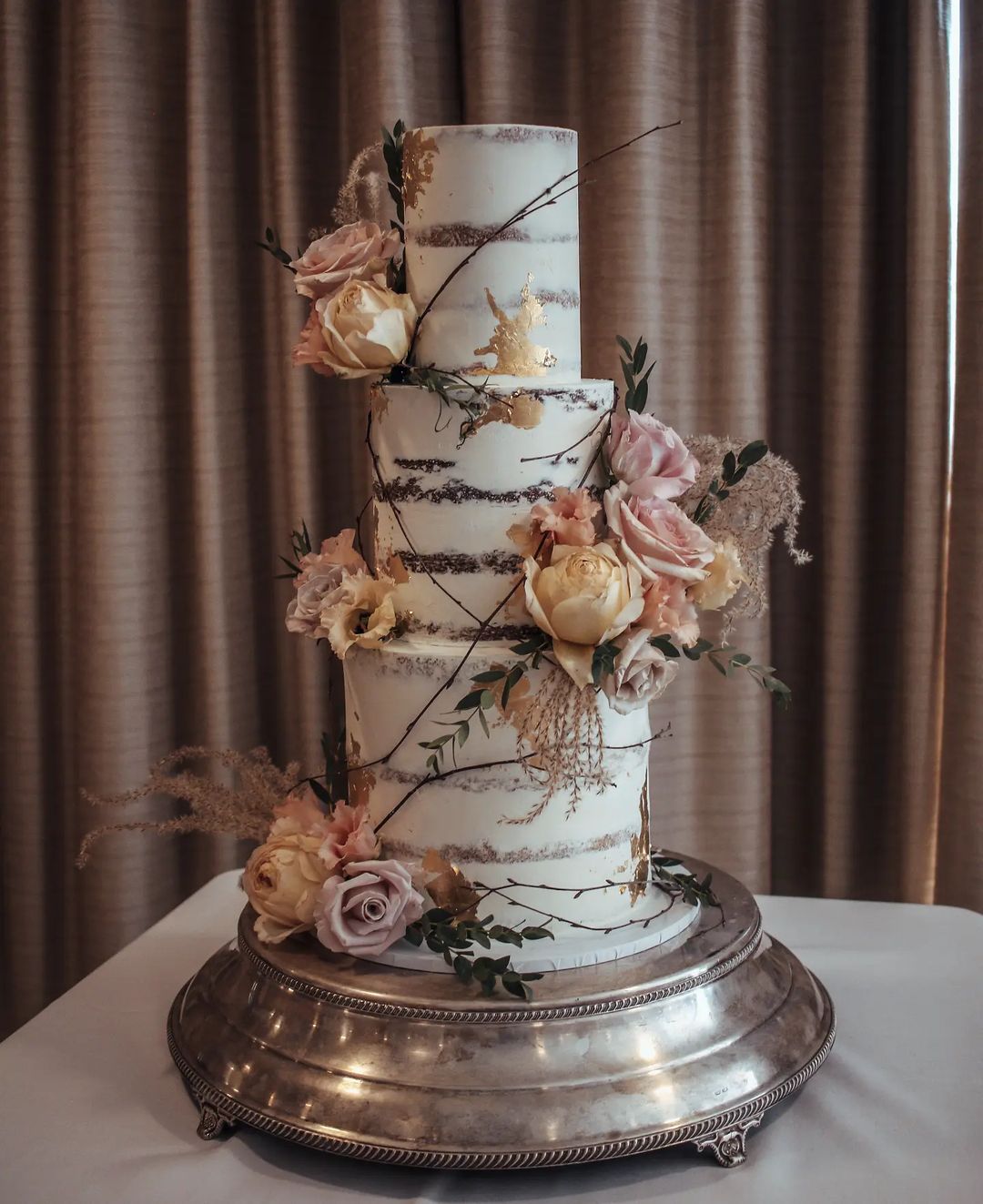 country semi-naked wedding cake with pink peach roses via sallycoopercakeartist