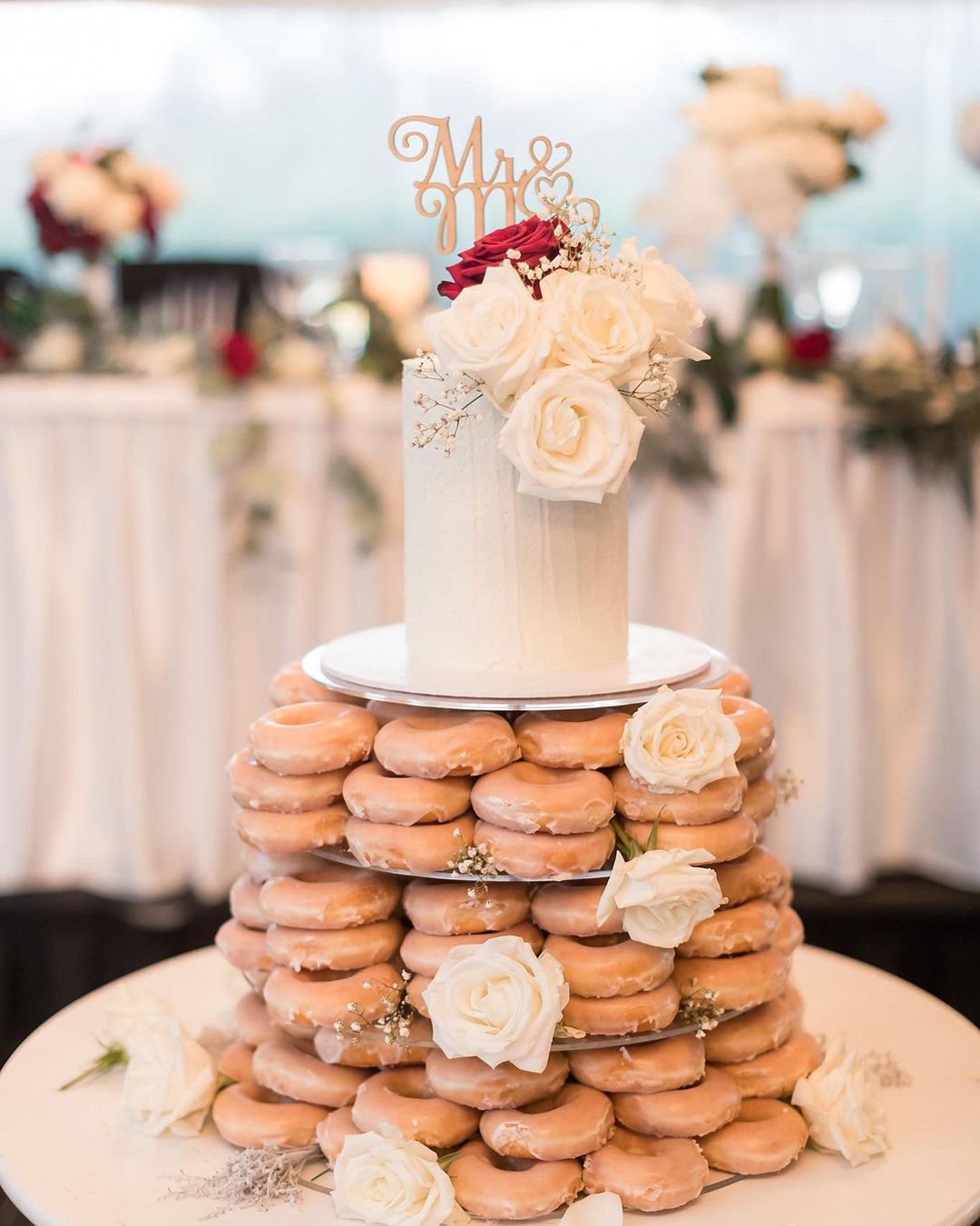 donuts tower with one small wedding cake via sprinkles_2_crumbs