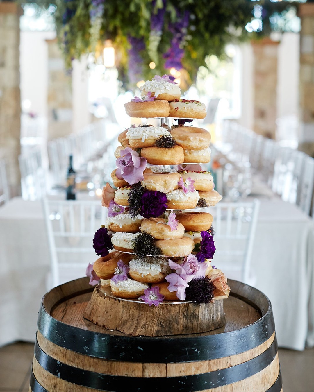donuts wedding cake with purple flowers via enzohuntervalley