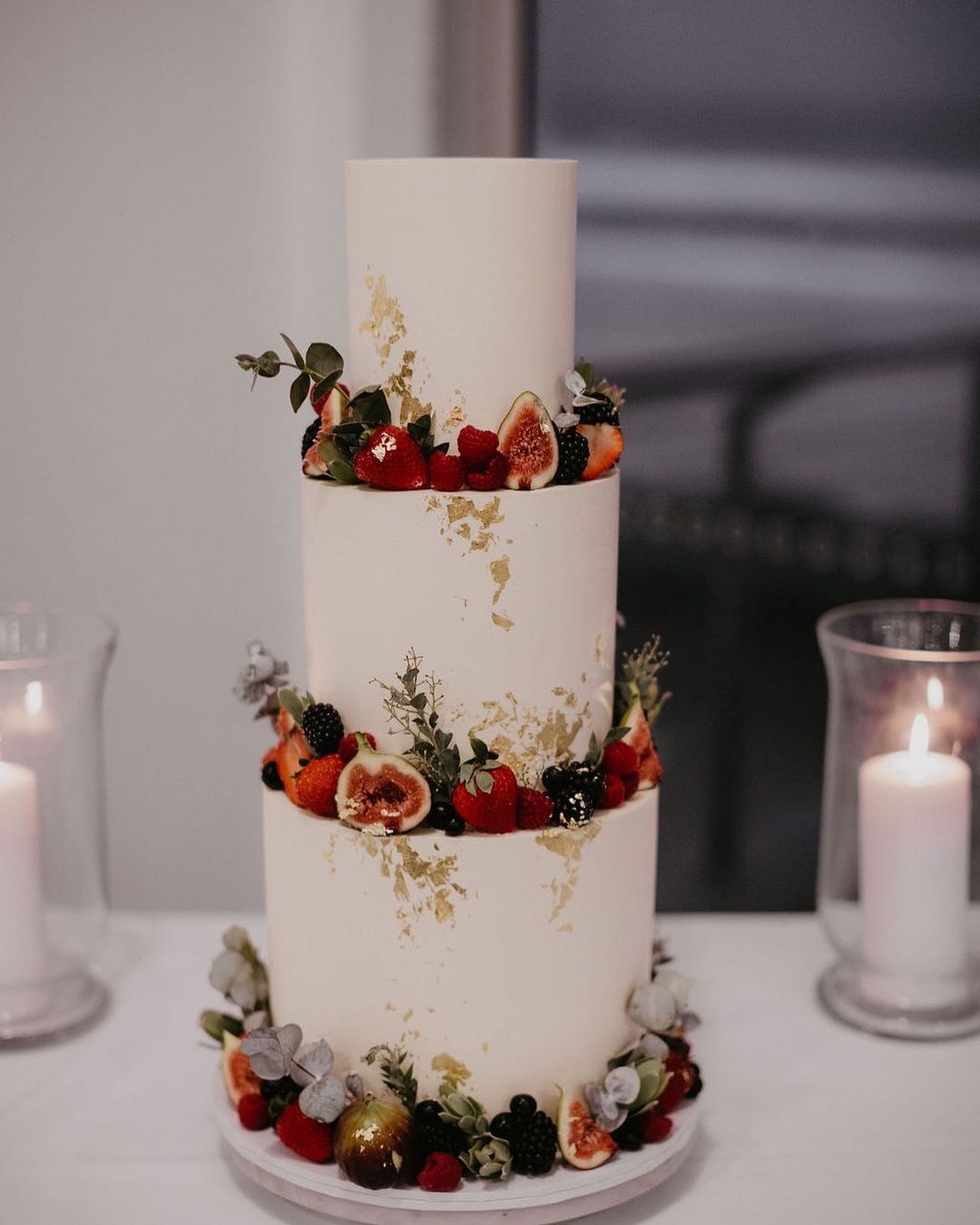 elegant simple 3 tier wedding cake with fruits and gold foil via milkandhoney.cakecreative