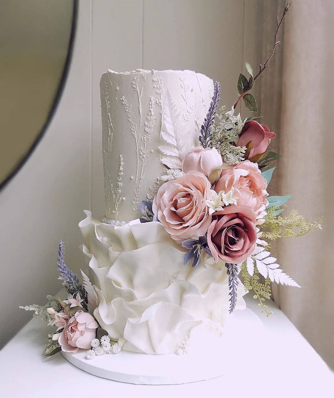 elegant textured two tier wedding cake with pink artificial flowers via littlemissfattycakes