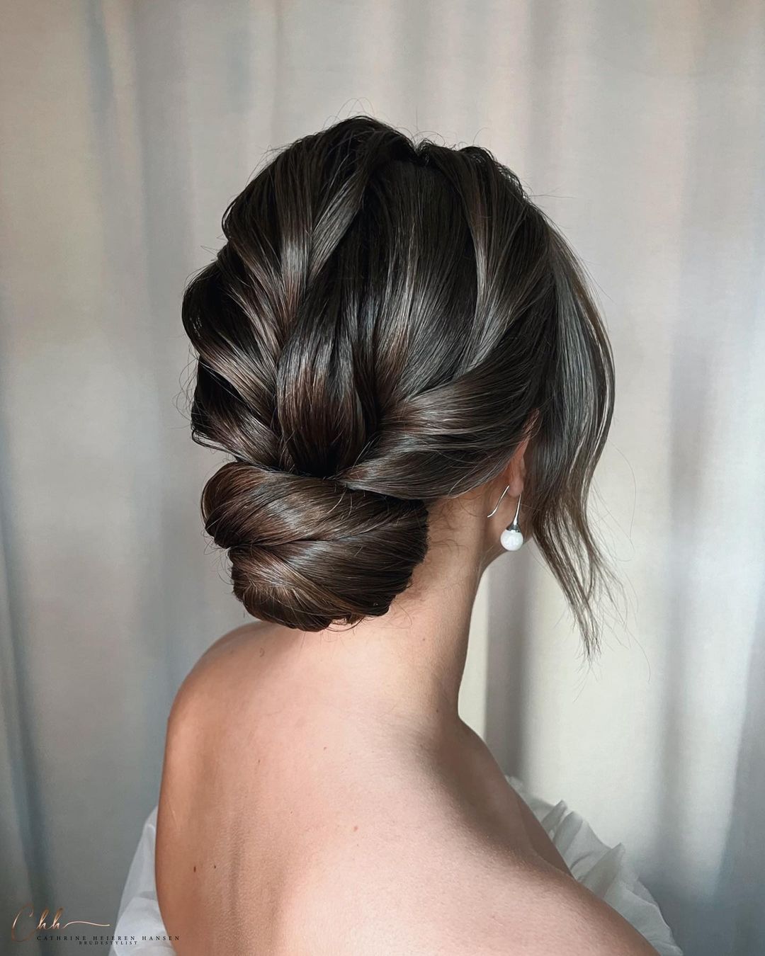 elegant twist black bridesmaid updo via cathrineheierenhansen