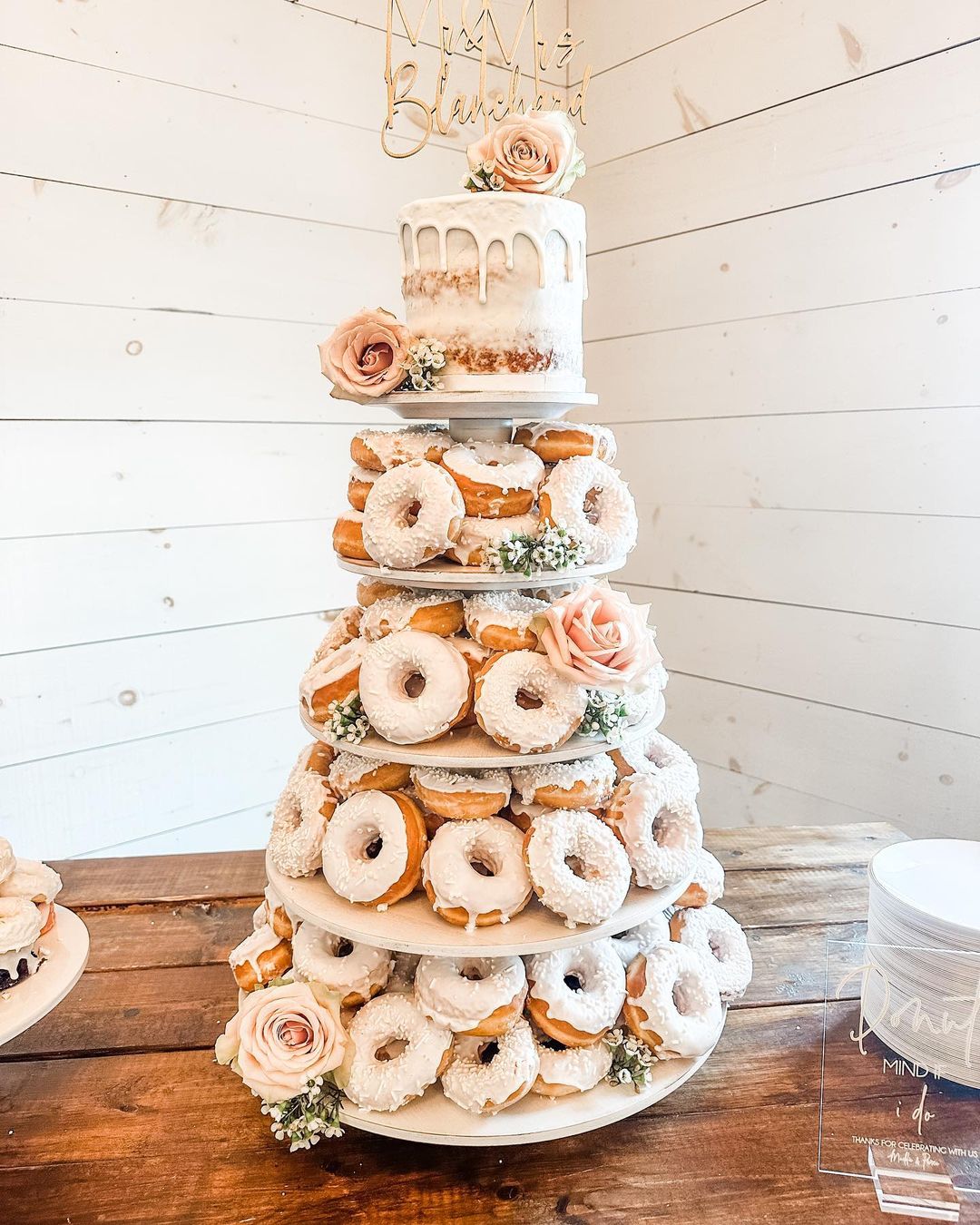 elegant white white chocolate wedding cake with donuts tower via southernsistersevents